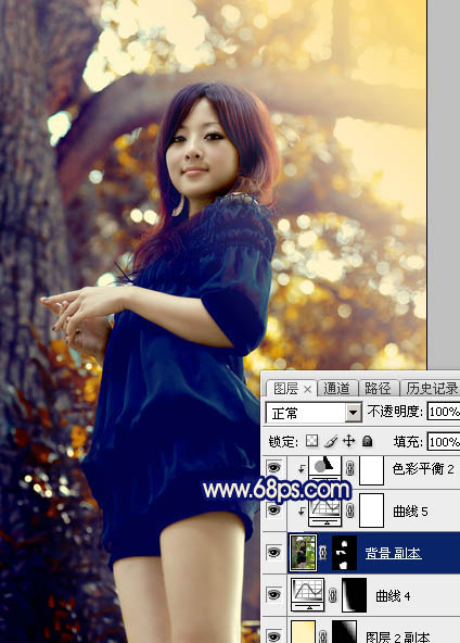 Photoshop将大树边的人物调制出斑斓的霞光暖色