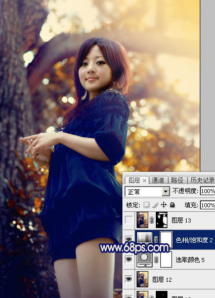 Photoshop将大树边的人物调制出斑斓的霞光暖色