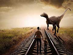 用PS合成火车轨道上拦住父子两人的巨型恐龙海报教程