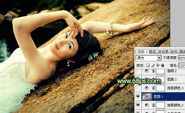 Photoshop将石壁上的女生图片调制成漂亮的黄青色效果