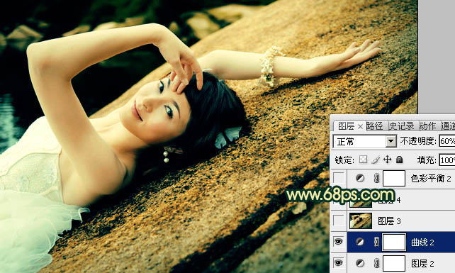 Photoshop将石壁上的女生图片调制成漂亮的黄青色效果