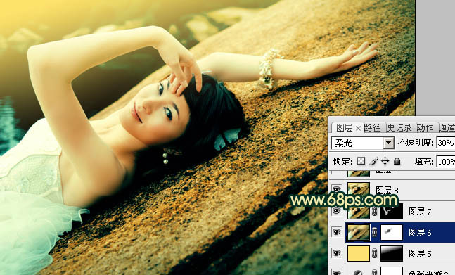 Photoshop将石壁上的女生图片调制成漂亮的黄青色效果