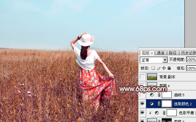 Photoshop为荒草中的美女加上唯美的秋季红褐色